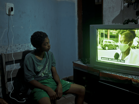 Caio watches television at home