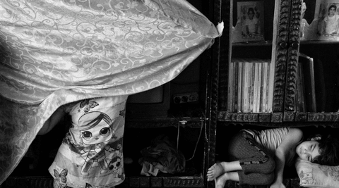 Lara (left), 12, and her younger sister, Celile, 5, in their home. Their father, Celal, works in construction but, like many in Istasyon, has been jobless since the beginning of the COVID-19 pandemic and unable to find work. The family survives thanks to the assistance they receive monthly from Turkish Red Crescent.