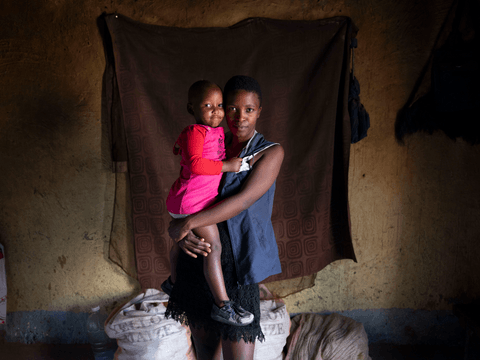 Bunam and her Aunt Cepheni smile for a posed portrait.