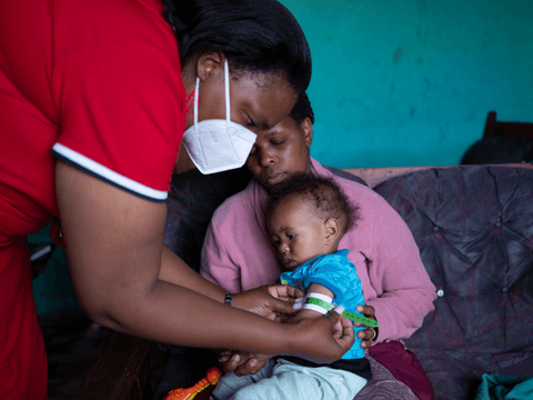 Marlon’s caregiver makes a home visit to monitor his recovery.