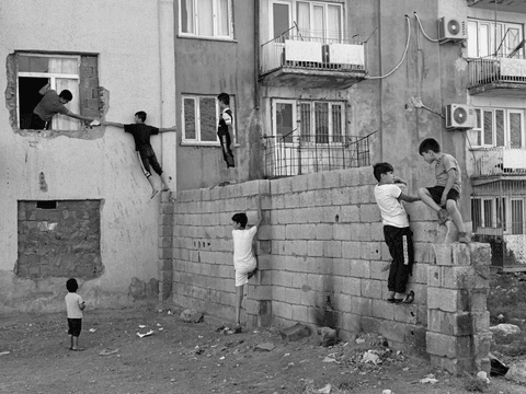 Syrian children play in a garden in Istasyon, Mardin.