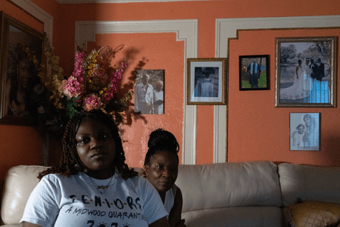 Elaine and her daughter Julissa in the living room of the family home in Brooklyn, New York.